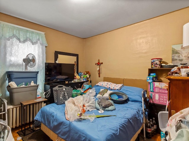 bedroom with hardwood / wood-style floors