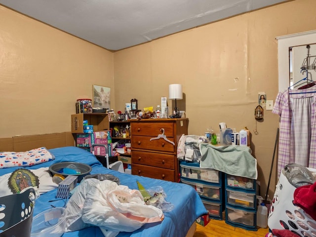 bedroom with hardwood / wood-style floors