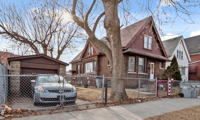 view of front of property with a garage and an outdoor structure