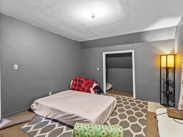 bedroom featuring vaulted ceiling