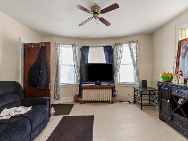 living room featuring radiator and ceiling fan