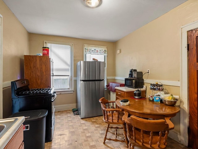 kitchen with sink and black appliances