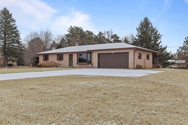 ranch-style home with a garage and a front lawn