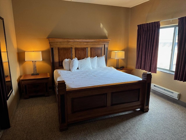 bedroom featuring a baseboard heating unit and dark carpet