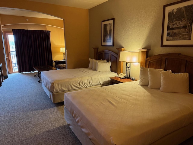 bedroom featuring carpet flooring and access to exterior