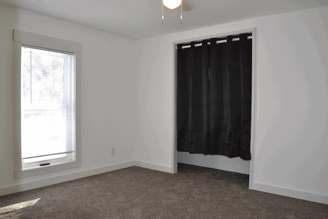 carpeted spare room with a healthy amount of sunlight