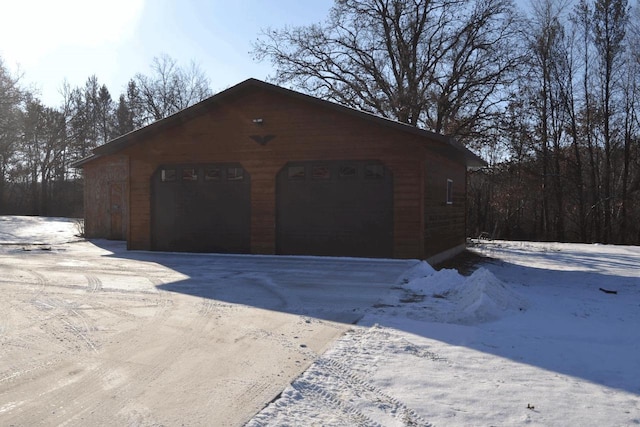 view of snow covered garage