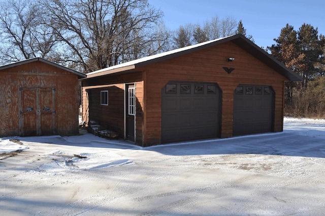 view of snow covered garage