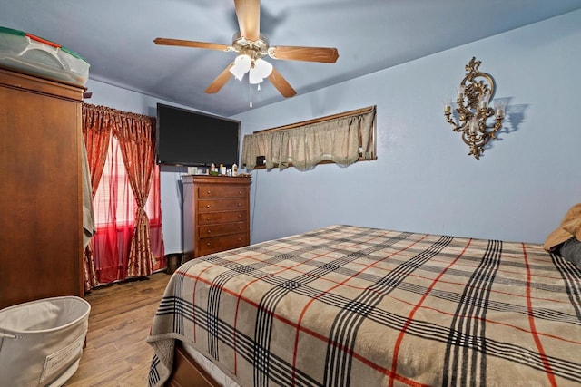 bedroom featuring ceiling fan and light hardwood / wood-style flooring