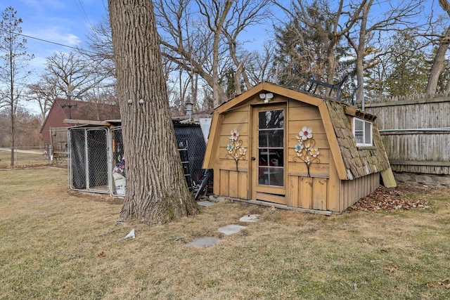 view of outbuilding featuring a yard