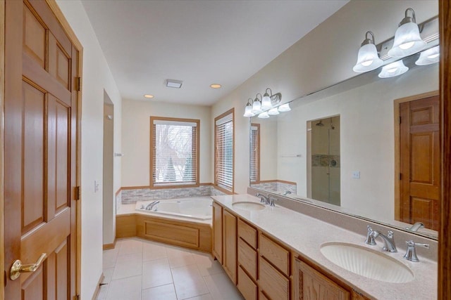 bathroom with vanity, a bath, and tile patterned flooring