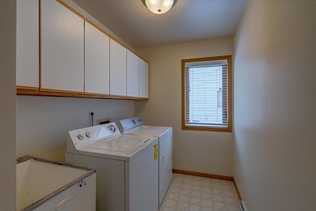 laundry area with cabinets, washer and clothes dryer, and sink