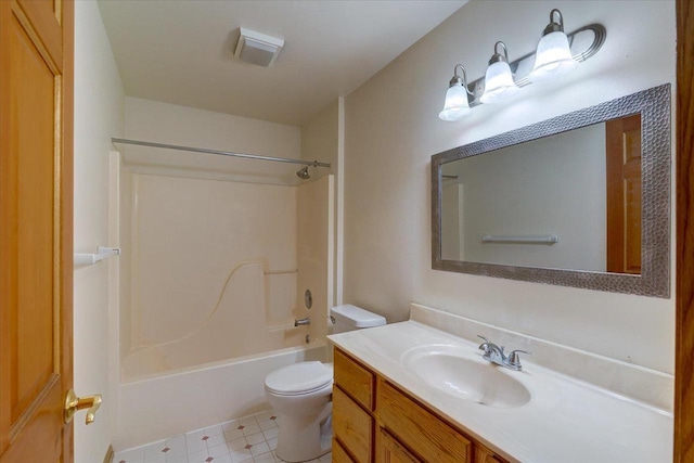 full bathroom with vanity, tub / shower combination, and toilet