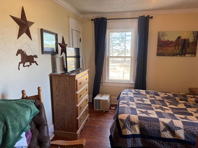 bedroom with ornamental molding, a textured ceiling, and dark hardwood / wood-style flooring