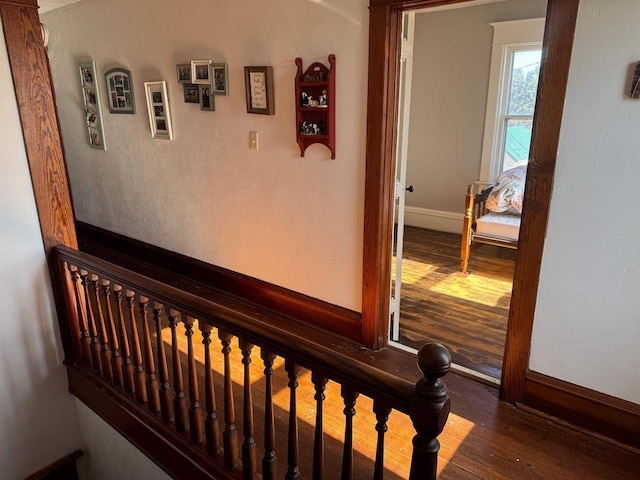 hall with wood-type flooring