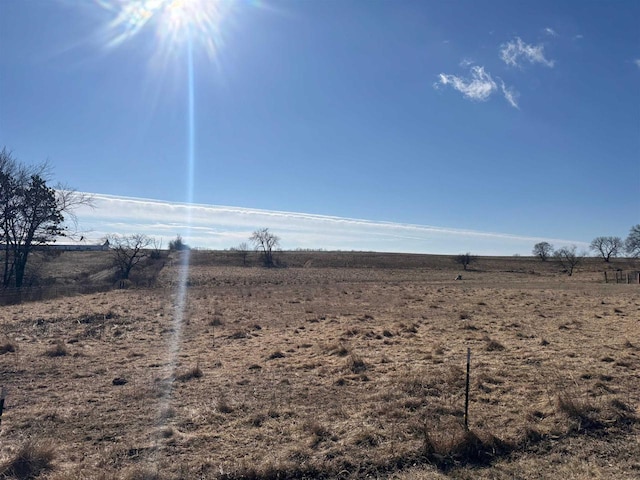 view of yard with a rural view