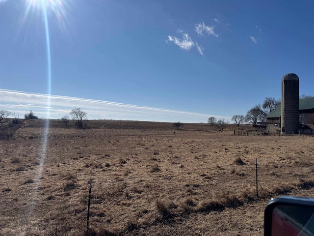 view of yard with a rural view