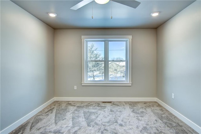 empty room with light carpet and ceiling fan