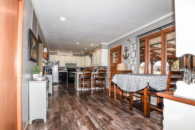 dining room featuring crown molding and dark wood-type flooring