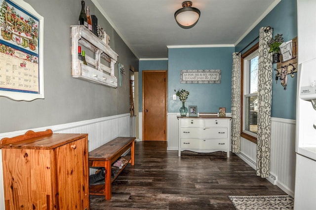 interior space featuring ornamental molding and dark hardwood / wood-style flooring