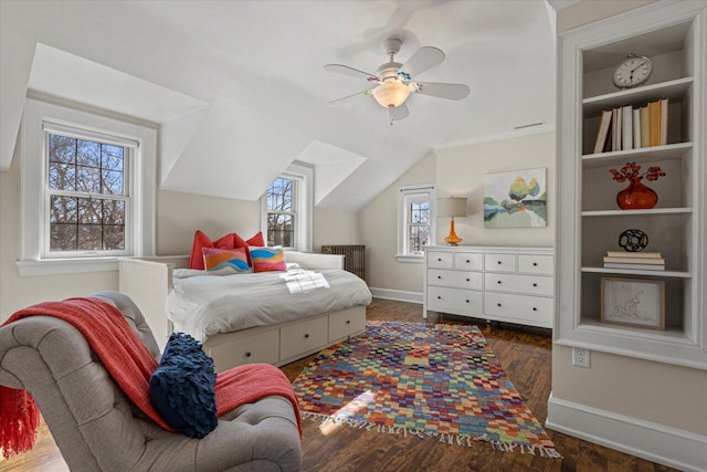 bedroom with dark wood-type flooring, ceiling fan, and lofted ceiling