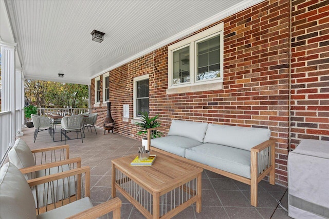 view of patio / terrace with an outdoor hangout area and covered porch