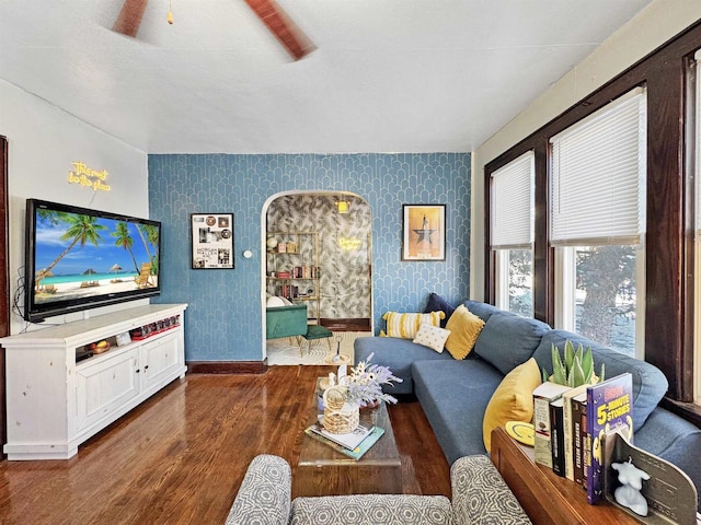 living room featuring dark hardwood / wood-style flooring and ceiling fan