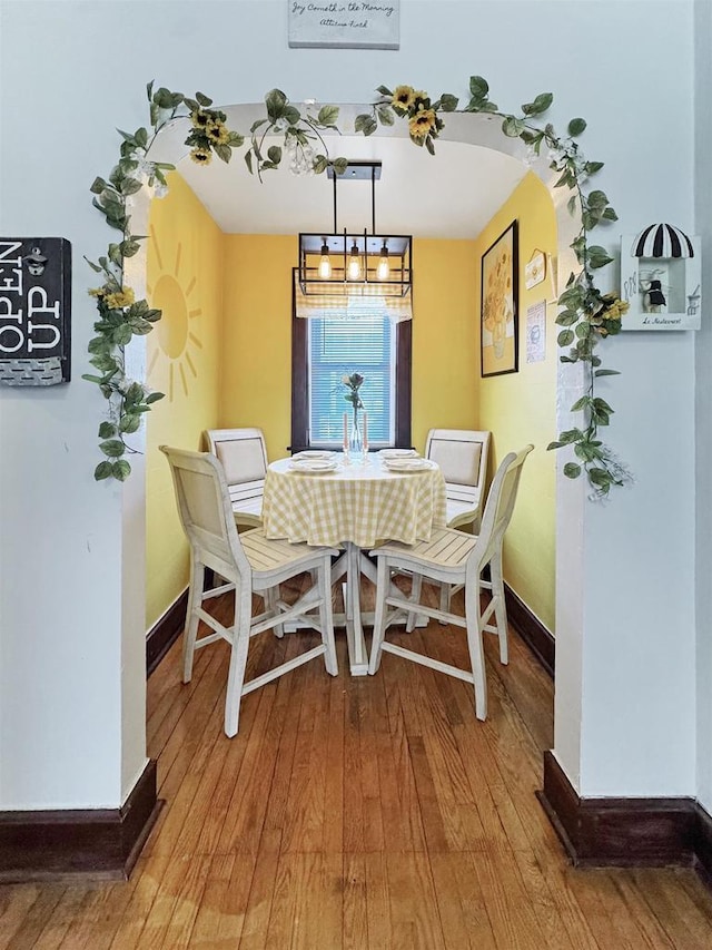 dining area with hardwood / wood-style flooring