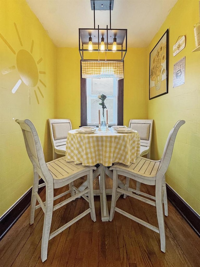 dining space featuring hardwood / wood-style floors