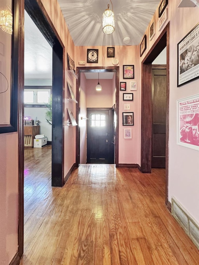 hall with light hardwood / wood-style flooring