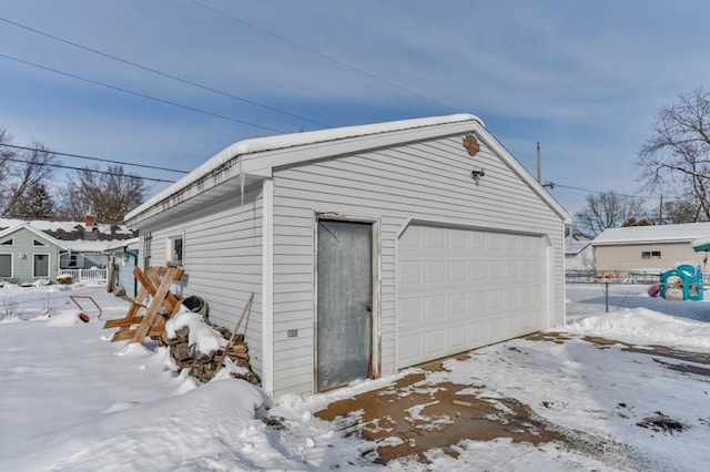 view of snow covered garage