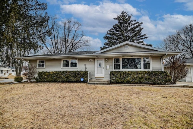 ranch-style home with a front lawn