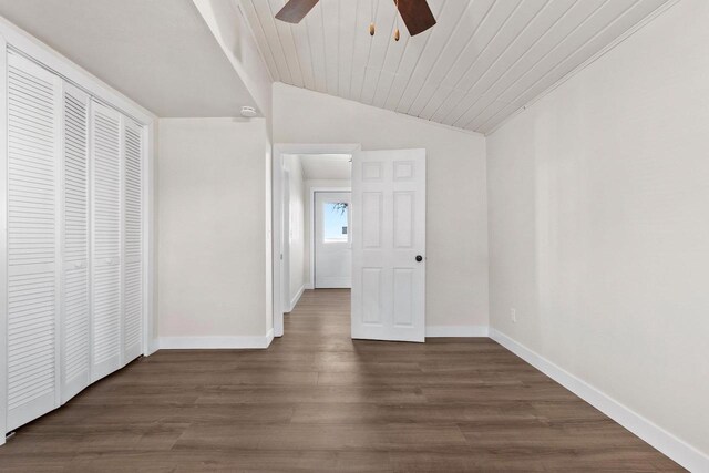 N9549 Bay Shore Ln, Luxemburg, WI 54217 - unfurnished bedroom featuring lofted ceiling, wood ceiling, dark wood-type flooring, ceiling fan, and a closet