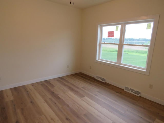 127 Linden Ln, Fox Lake, WI 53933 - unfurnished room with light wood-style flooring and ceiling fan