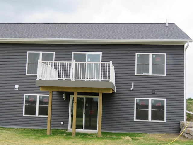 127 Linden Ln, Fox Lake, WI 53933 - rear view of property featuring a balcony and roof with shingles