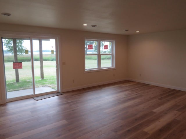 127 Linden Ln, Fox Lake, WI 53933 - empty room with wood finished floors and recessed lighting