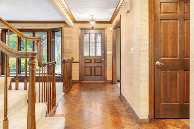 entryway with parquet flooring and ornamental molding