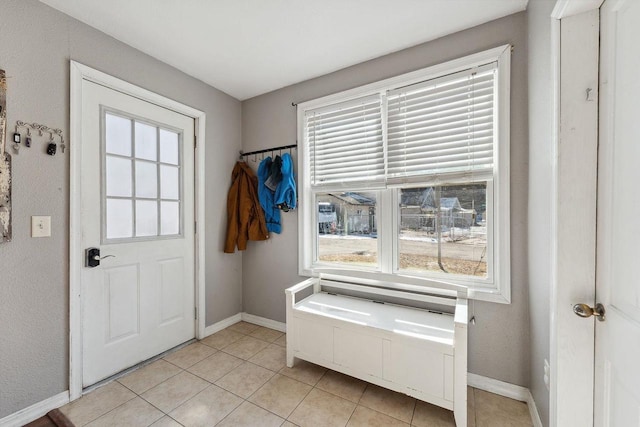 doorway to outside featuring light tile patterned floors