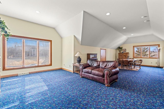 carpeted living room featuring lofted ceiling