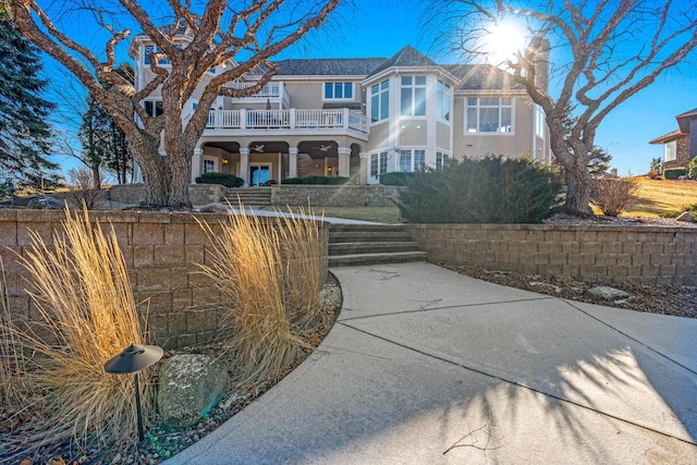 view of front of property with a balcony