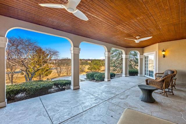 view of patio / terrace featuring ceiling fan and french doors