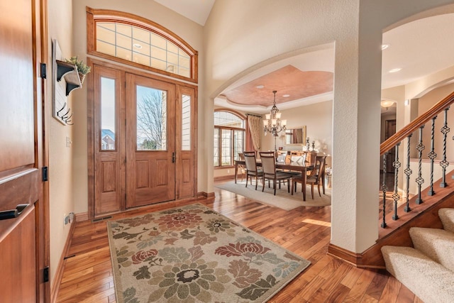 foyer featuring an inviting chandelier and light hardwood / wood-style floors