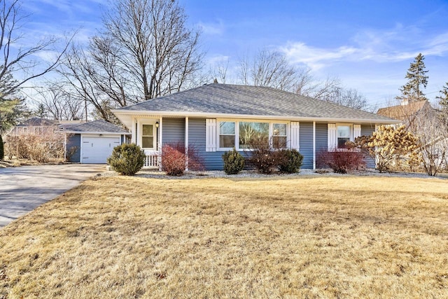 single story home with a garage and a front lawn