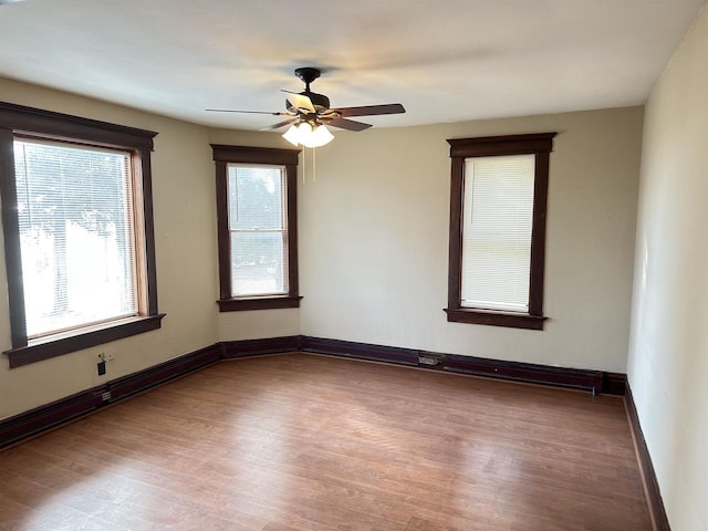 empty room featuring ceiling fan and light wood-type flooring