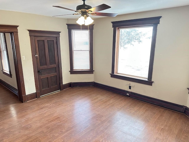 empty room featuring hardwood / wood-style floors and ceiling fan