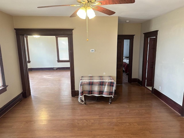 hall featuring hardwood / wood-style floors and baseboard heating