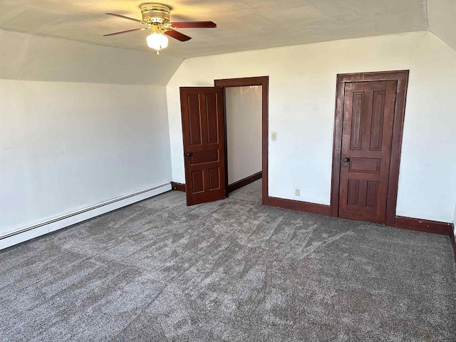 unfurnished bedroom featuring dark carpet, a baseboard radiator, ceiling fan, and vaulted ceiling