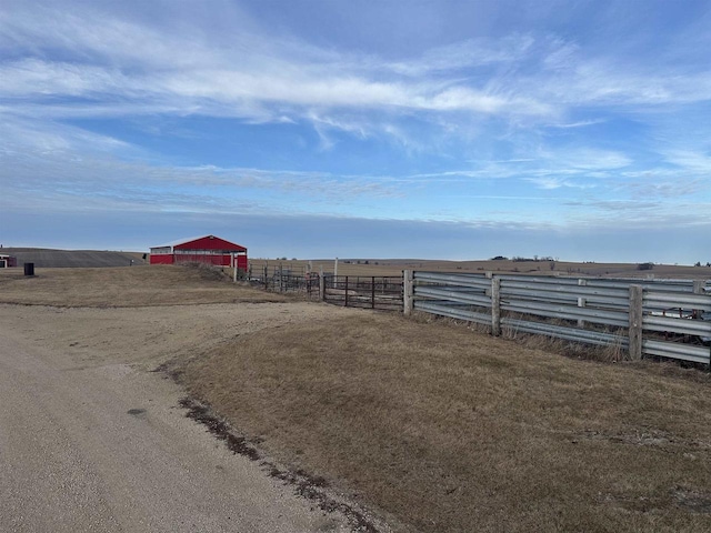 view of yard with a rural view