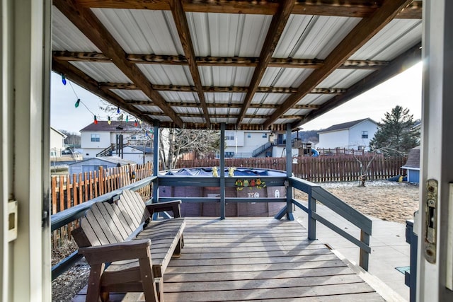 wooden deck featuring a jacuzzi