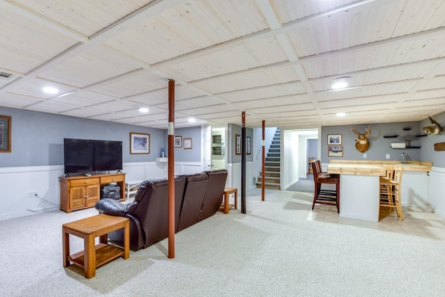 carpeted living room featuring indoor wet bar